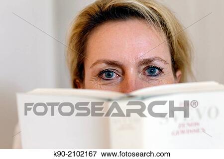 Stock Photo - Portrait of caucasian woman reading a book, Hamburg, Germany, Europe.. Fotosearch