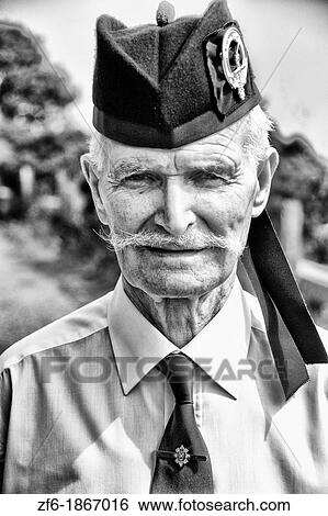 Portrait of colorful outfit and personality of bag pipe player at the Loch Ness area near Drumnadrochit home of the Loch Ness Monster Nessie in the Scotish Highland View Large Photo Image Stock Photograph - Portrait of colorful outfit and personality of bag pipe player at the Loch Ness area near Drumnadrochit home of the Loch Ness Monster Nessie in the Scotish Highland. Fotosearch