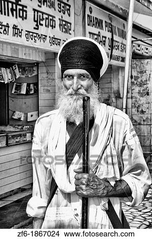 Portrait of colorful Sika Hindu religious man in famous Bangla Shib Gurudwara Sika Great Temple in New Delhi India View Large Photo Image Picture - Portrait of colorful Sika Hindu religious man in famous Bangla Shib Gurudwara Sika Great Temple in New Delhi India. Fotosearch