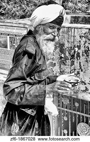 Portrait of colorful Sika Hindu religious man in famous Bangla Shib Gurudwara Sika Great Temple in New Delhi India View Large Photo Image Stock Photo - Portrait of colorful Sika Hindu religious man in famous Bangla Shib Gurudwara Sika Great Temple in New Delhi India. Fotosearch