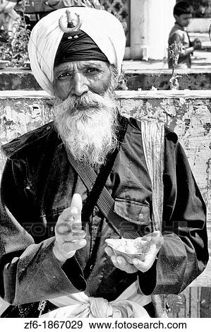 Portrait of colorful Sika Hindu religious man in famous Bangla Shib Gurudwara Sika Great Temple in New Delhi India View Large Photo Image Stock Photo - Portrait of colorful Sika Hindu religious man in famous Bangla Shib Gurudwara Sika Great Temple in New Delhi India. Fotosearch