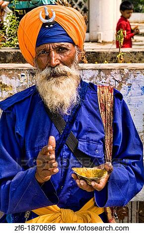 Portrait of colorful Sika Hindu religious man in famous Bangla Shib Gurudwara Sika Great Temple in New Delhi India View Large Photo Image Stock Photograph - Portrait of colorful Sika Hindu religious man in famous Bangla Shib Gurudwara Sika Great Temple in New Delhi India. Fotosearch