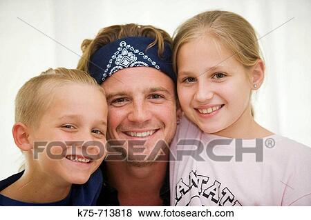 portrait of dad and his two children View Large Photo Image Stock Photo - portrait of dad and his two children. Fotosearch