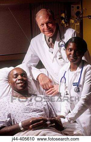 Portrait of doctor, nurse and patient in hospital room View Large Photo Image Stock Image - Portrait of doctor, nurse and patient in hospital room. Fotosearch