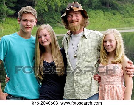 Portrait of father and children outdoors View Large Photo Image Stock Image - Portrait of father and children outdoors. Fotosearch