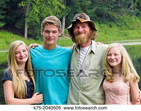 Portrait of father and children outdoors View Large Photo Image Stock Photography - Portrait of father and children outdoors. Fotosearch