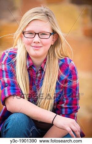 Portrait of female Caucasian child with long blond hair and glasses. View Large Photo Image Stock Image - Portrait of female Caucasian child with long blond hair and glasses.. Fotosearch