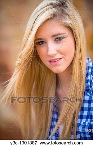 Stock Photo - Portrait of female Caucasian teenager with long blond hair.. Fotosearch