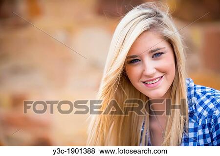 Portrait of female Caucasian teenager with long blond hair. View Large Photo Image Stock Photo - Portrait of female Caucasian teenager with long blond hair.. Fotosearch