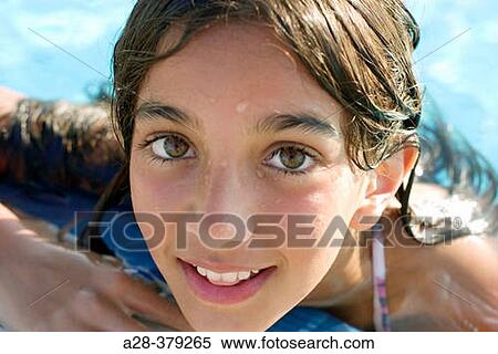 Portrait of girl (13 years) at the edge of a swimming pool. El Quesir. Egypt. View Large Photo Image Stock Photography - Portrait of girl (13 years) at the edge of a swimming pool. El Quesir. Egypt.. Fotosearch