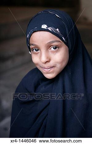Stock Photograph - Portrait of girl, Ancient City, World Heritage UNESCO, Sanaa, Yemen. Fotosearch