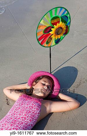 Stock Photo - portrait of girl on the beach. Fotosearch