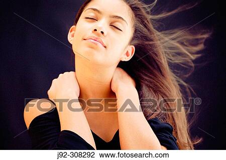 Stock Image - Portrait of girl with closed eyes.. Fotosearch