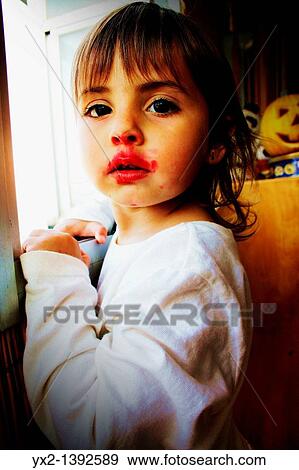 Stock Photo - Portrait of girl with lipstick. Fotosearch