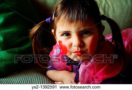 Stock Image - Portrait of girl with pigtails. Fotosearch
