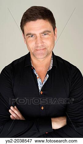Portrait of handsome man showing determination and confidence. View Large Photo Image Stock Photo - Portrait of handsome man showing determination and confidence.. Fotosearch