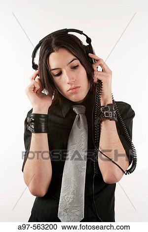 Stock Image - Portrait of handsome teen boy wearing headset.. Fotosearch