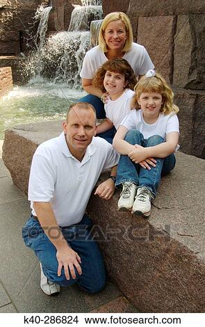 Portrait of husband, wife, and daughters View Large Photo Image Picture - Portrait of husband, wife, and daughters. Fotosearch