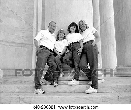 Portrait of husband, wife, and two daughters View Large Photo Image Stock Image - Portrait of husband, wife, and two daughters. Fotosearch