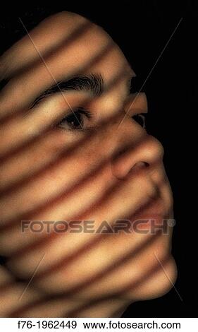 Portrait of iranian woman with shadows from venetian blinds across her face View Large Photo Image Stock Photo - Portrait of iranian woman with shadows from venetian blinds across her face. Fotosearch