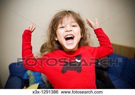 Portrait of little girl having fun making a face View Large Photo Image Stock Photograph - Portrait of little girl having fun making a face. Fotosearch