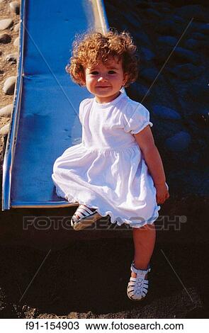 Portrait of little girl on playground View Large Photo Image Stock Image - Portrait of little girl on playground. Fotosearch