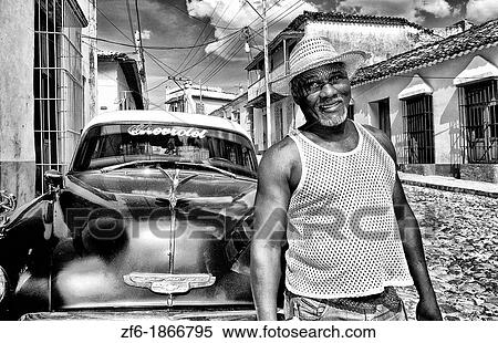 Portrait of local man in front of classic 50s blue Chevy on streets of Trinidad Cuba View Large Photo Image Stock Photography - Portrait of local man in front of classic 50s blue Chevy on streets of Trinidad Cuba. Fotosearch