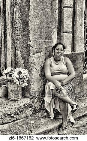 Portrait of local woman selling flowers from her apartment in central Havana Habana Cuba View Large Photo Image Stock Image - Portrait of local woman selling flowers from her apartment in central Havana Habana Cuba. Fotosearch