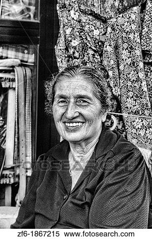 Portrait of local woman who sells fabric and clothes in Cyprus View Large Photo Image Stock Photography - Portrait of local woman who sells fabric and clothes in Cyprus. Fotosearch