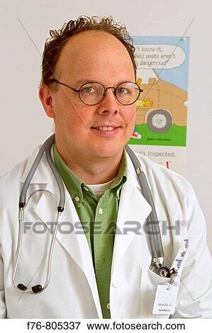 Portrait of male physician with stethoscope View Large Photo Image Stock Photo - Portrait of male physician with stethoscope. Fotosearch