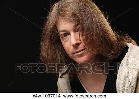 Picture - Portrait of male to female transgender woman in mid-transition. Fotosearch