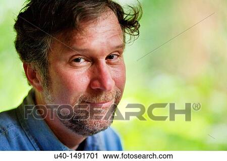 Stock Image - Portrait of man smiling. Fotosearch