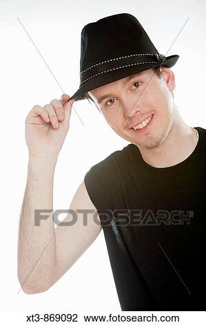 portrait of man wearing a hat View Large Photo Image Stock Image - portrait of man wearing a hat. Fotosearch