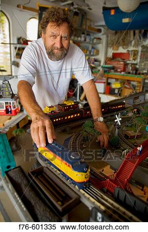 Portrait of man with model train. View Large Photo Image Stock Photography - Portrait of man with model train.. Fotosearch
