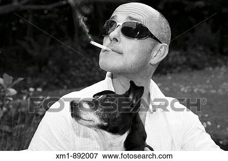 Portrait of man with sunglasses and Jack Russell dog View Large Photo Image Stock Photo - Portrait of man with sunglasses and Jack Russell dog. Fotosearch