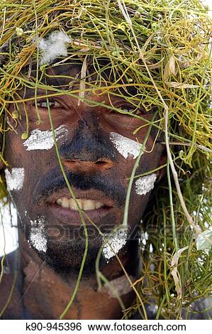 Portrait of Melanesian men with traditional facial paint of the Snake Dance performer and green grass as headcover, Ra Island, Banks Groups, Vanuatu, Melanesia, South Pacific View Large Photo Image Stock Photograph - Portrait of Melanesian men with traditional facial paint of the Snake Dance performer and green grass as headcover, Ra Island, Banks Groups, Vanuatu, Melanesia, South Pacific. Fotosearch