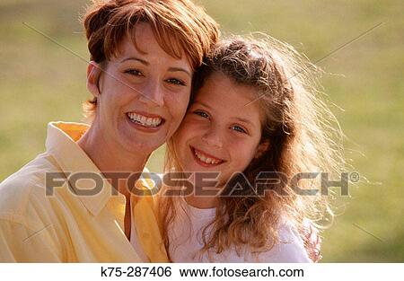 portrait of mom and daughter in park View Large Photo Image Stock Photograph - portrait of mom and daughter in park. Fotosearch