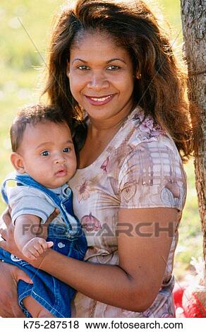Stock Photo - Portrait of mom and her new son. Fotosearch