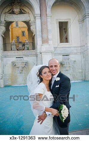 Portrait of newlyweds in front of Water fountain Fontanone dell Acqua Paola known as the Fontanone del Gianicolo Rome, Italy View Large Photo Image Stock Image - Portrait of newlyweds in front of Water fountain Fontanone dell Acqua Paola known as the Fontanone del Gianicolo Rome, Italy. Fotosearch
