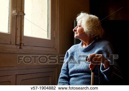 Portrait of old woman at home, smiling and looking at the window View Large Photo Image Stock Image - Portrait of old woman at home, smiling and looking at the window. Fotosearch