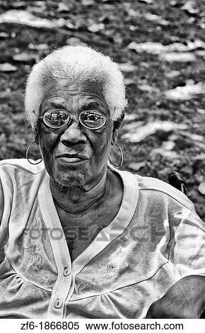 Stock Photography - Portrait of older woman in park in Guanabacoa a town near Havana Cuba Habana. Fotosearch