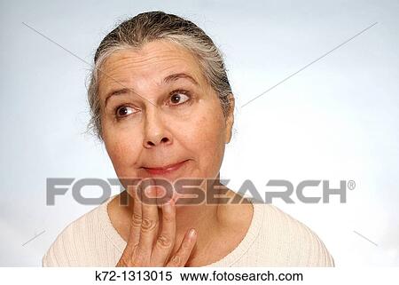 Portrait of older woman wondering and thinking about something View Large Photo Image Stock Photography - Portrait of older woman wondering and thinking about something. Fotosearch