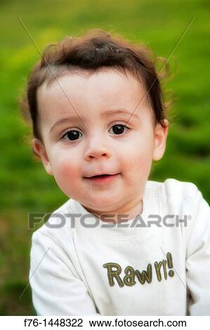 Portrait of one year old boy with large dark eyes, looking up View Large Photo Image Stock Image - Portrait of one year old boy with large dark eyes, looking up. Fotosearch