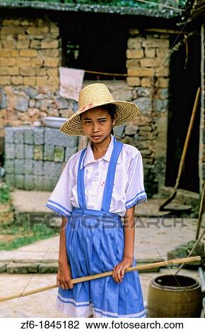 Stock Image - Portrait of poor girl at home in Guilin China. Fotosearch