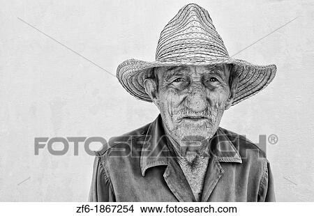 Portrait of poor man with straw hat in small town of Australia Cuba View Large Photo Image Picture - Portrait of poor man with straw hat in small town of Australia Cuba. Fotosearch