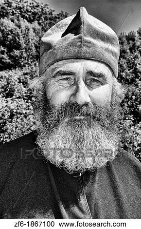 Portrait of Russian Orthodox priest in red hat in country of Lviv Ukraine View Large Photo Image Stock Image - Portrait of Russian Orthodox priest in red hat in country of Lviv Ukraine. Fotosearch