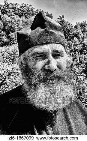 Stock Photo - Portrait of Russian Orthodox priest in red hat in country of Lviv Ukraine. Fotosearch