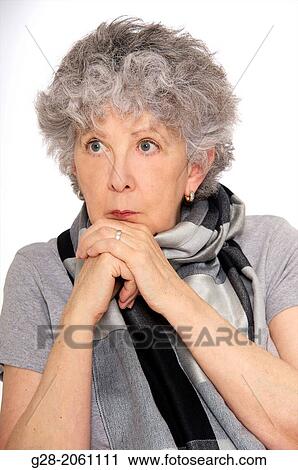 Portrait of Senior woman in grey, thoughtful, resting her chin on her hands View Large Photo Image Stock Image - Portrait of Senior woman in grey, thoughtful, resting her chin on her hands. Fotosearch