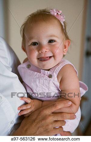 Portrait of smiling infant girl. View Large Photo Image Stock Photograph - Portrait of smiling infant girl.. Fotosearch
