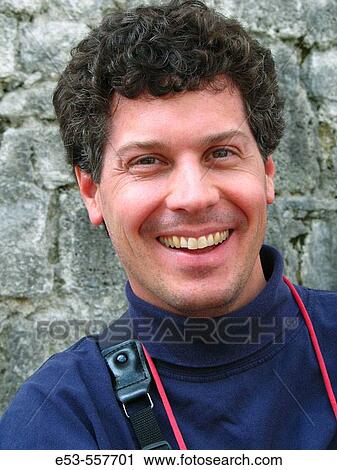 Portrait of smiling man, early 40s, against wall of Festung Hohensalzburg (castle), Salzburg, Austria View Large Photo Image Stock Image - Portrait of smiling man, early 40s, against wall of Festung Hohensalzburg (castle), Salzburg, Austria. Fotosearch